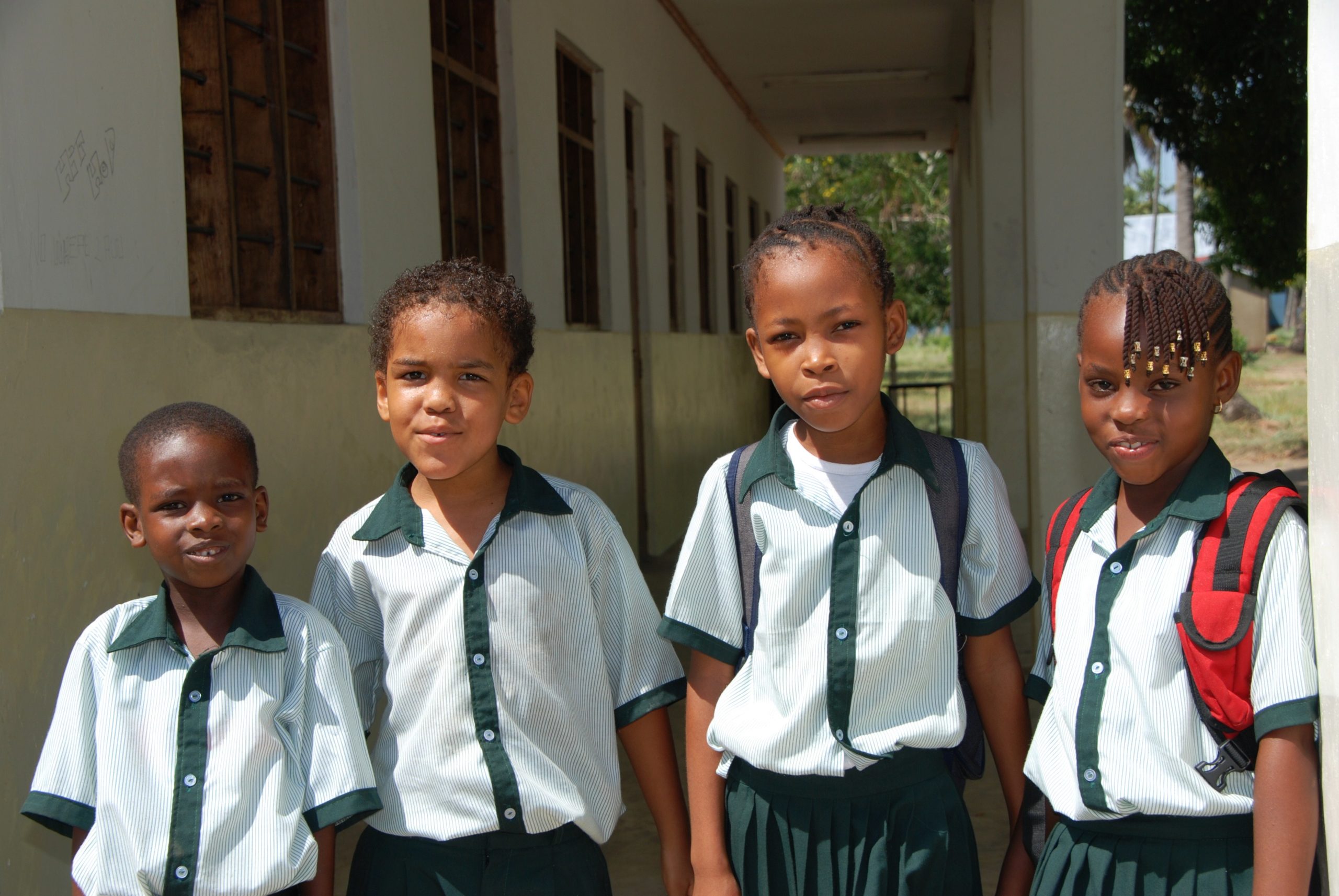 4 elementary students in school uniforms